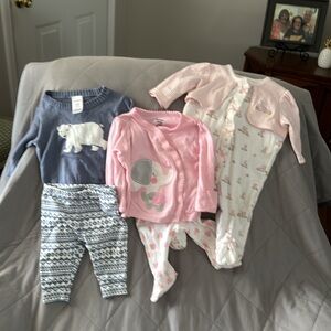 3 newborn outfits. A Gerber, Carters & little me